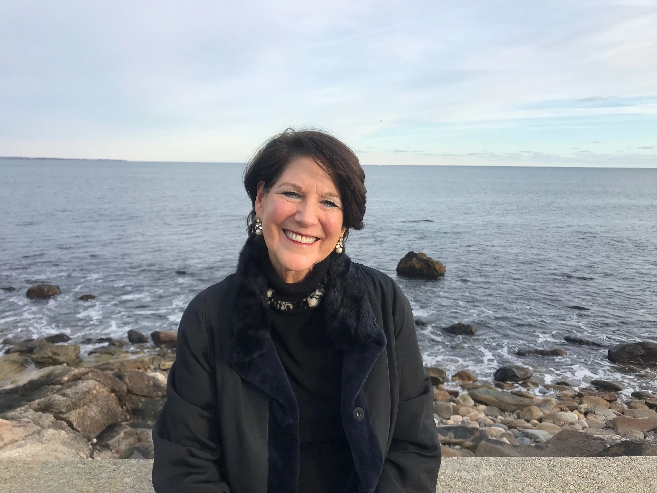 Mary Kozik, MBK Coaching founder, on a rocky beach
